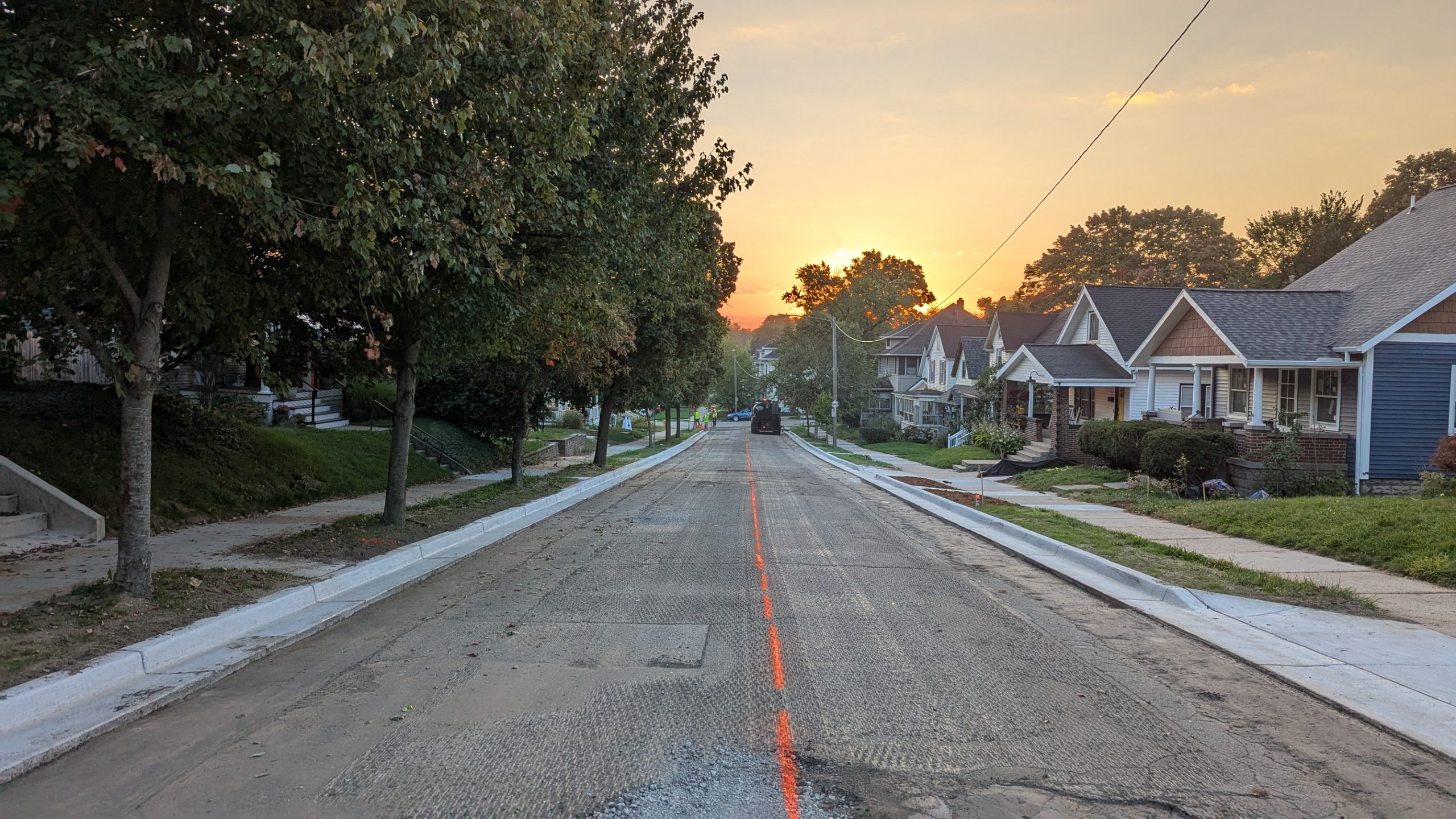 A road crew preparing our street for a new layer of asphalt.
